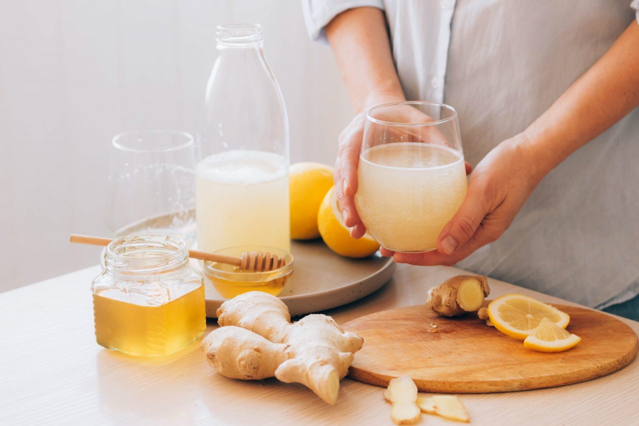women-s-hands-hold-glass-with-drink-made-from-ginger-root-honey-lemon-freshly-prepared-antioxidant.jpg